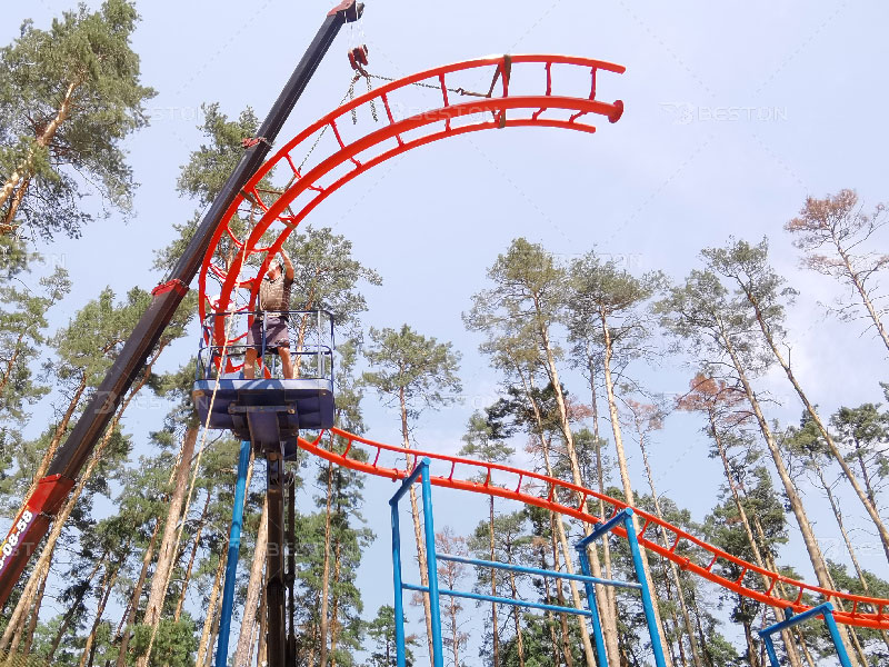Installation of kiddie roller coaster ride in Russia amusement park